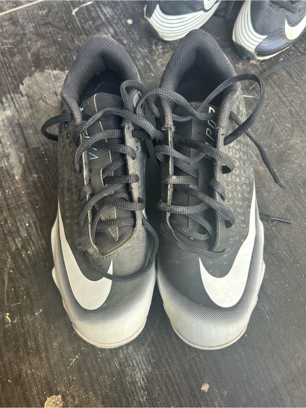 Nike Black and White Cleats with Large Swoosh